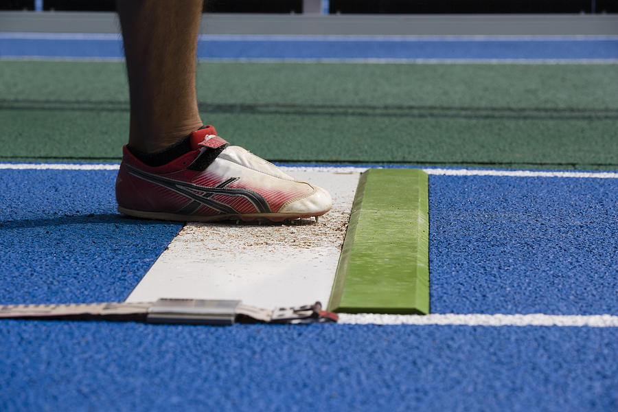 Athlete Long Jumping,close Up Photograph by Michael H