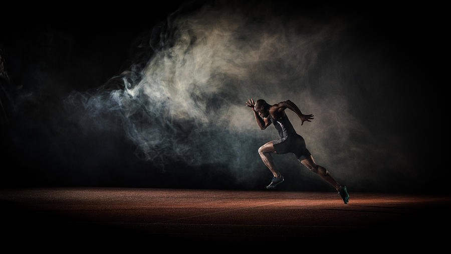 Athlete running Photograph by Simonkr