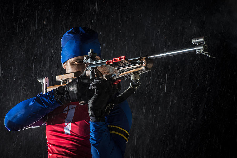 Athletic man with biathlon rifle Photograph by Simonkr