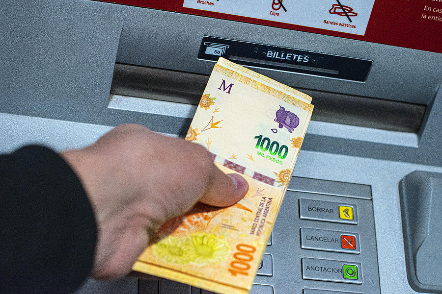 ATM. Cash machine. Argentine pesos. Cash withdrawal. Money in Argentina. Photograph by Javier Ghersi ATM. Cash machine. Argentine pesos. Cash withdrawal. Money in Argentina. Photograph by Javier Ghersi