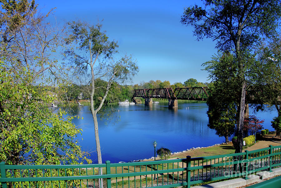 Augusta, GA riverwalk view of railroad bridge Photograph by Ules Barnwell