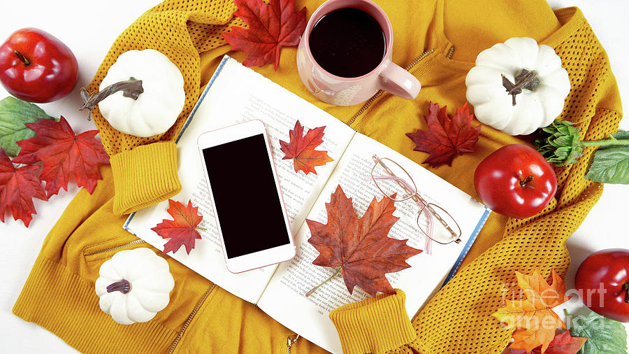 Autumn Fall Thanksgiving hygge flatlay with sweater, reading glasses and book. Photograph by Milleflore Images