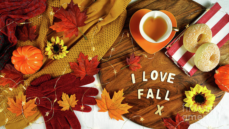 Autumn Fall theme flatlay with cozy sweater, bagels and cups of herbal tea. Photograph by Milleflore Images