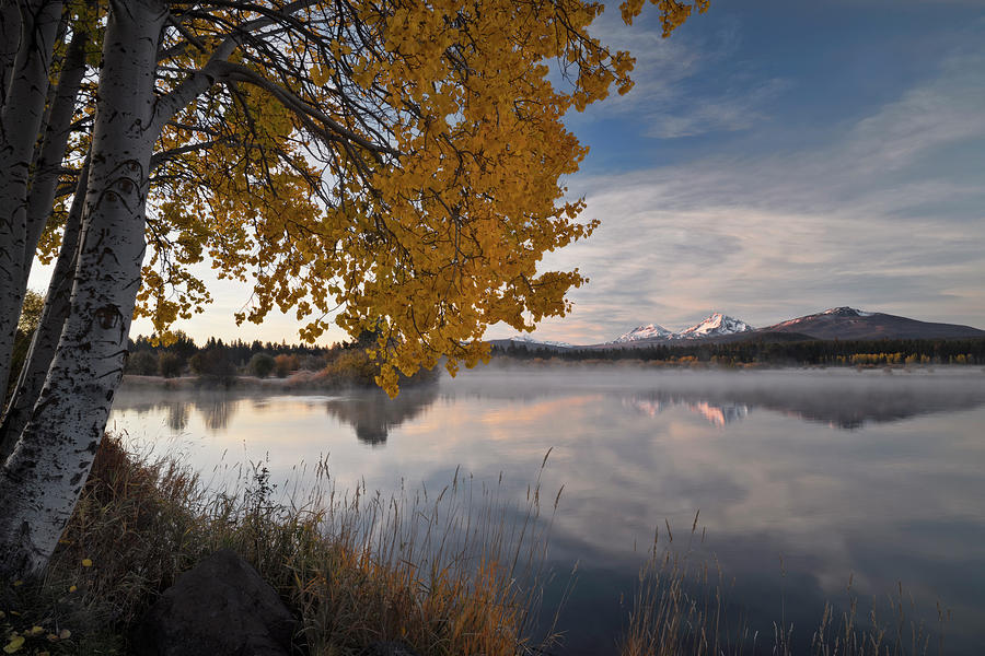 Bend Photograph - Autumn sunrise reveals snow capped Three Sisters and Broken Top. by Larry Geddis