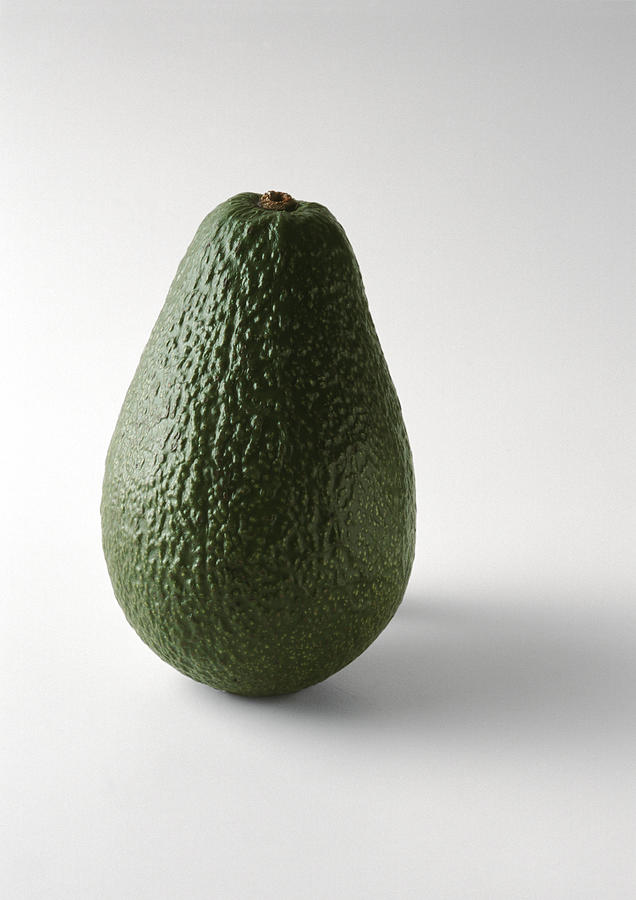 Avocado, standing on end, close-up Photograph by Isabelle Rozenbaum & Frederic Cirou