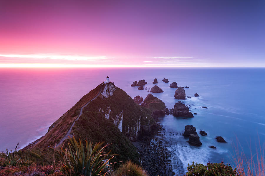 Awesome dawn, Nugget point lighthouse, New Zealand Photograph by Matteo Colombo
