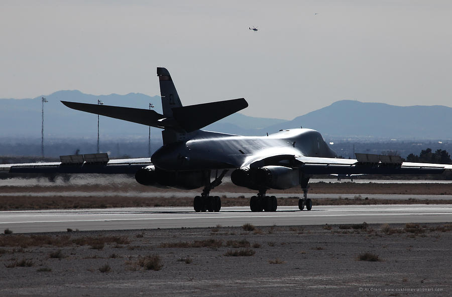 B-1B Lancer rolling out on Rwy 21L at Nellis AFB Photograph by Custom Aviation Art