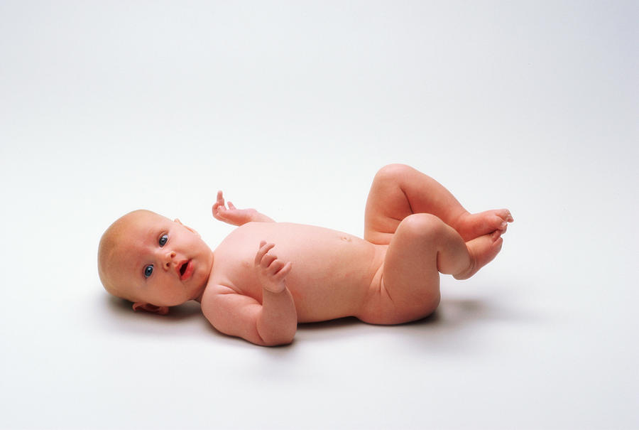 Baby (6-9 months) lying on back Photograph by Turner & de Vries