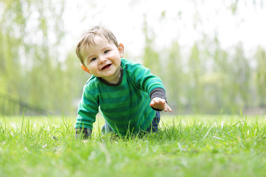 Baby Boy in the Grass - Crawling Photograph by Maartje van Caspel