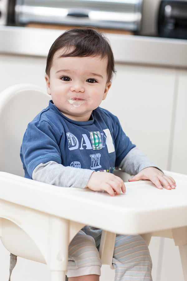 Baby boy smiling with messy mouth Photograph by Image Source