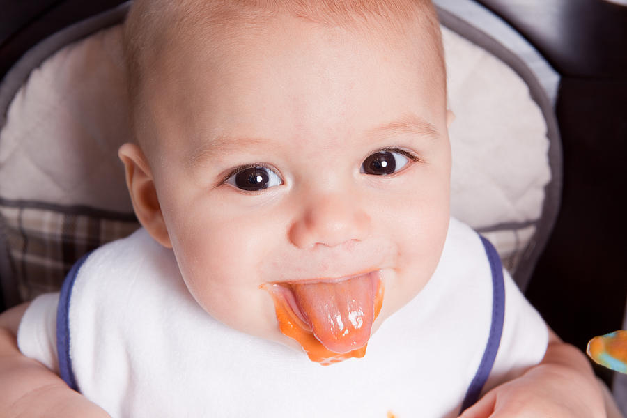 Baby Boy Sticking Tongue Out With Food Photograph by Sdominick
