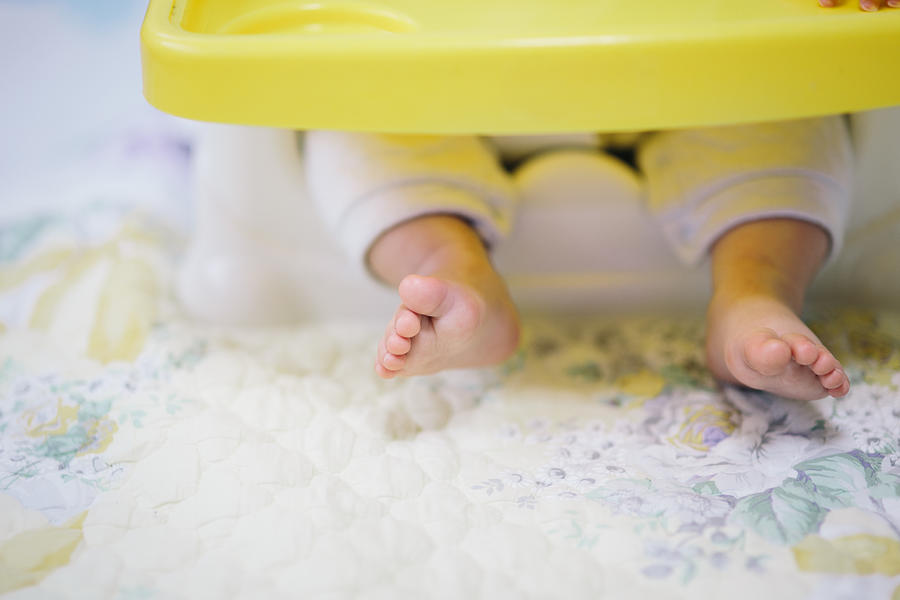 Baby feet in high chair Photograph by Insung Jeon