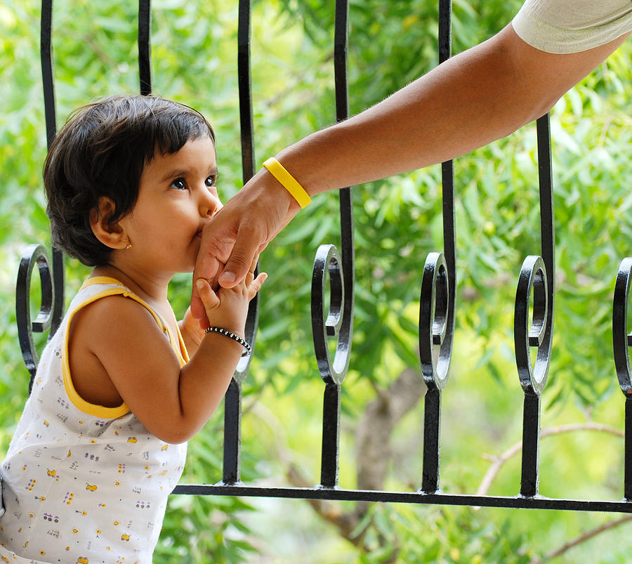 Baby girl kissing daddy hand Photograph by Shilpa Harolikar
