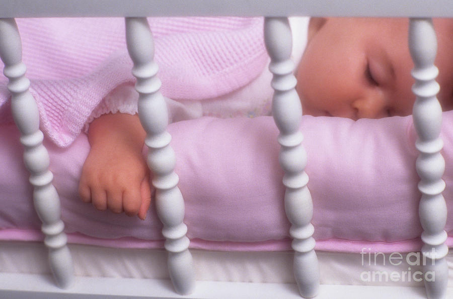Baby In Crib Sleeping  Photograph by Jim Corwin