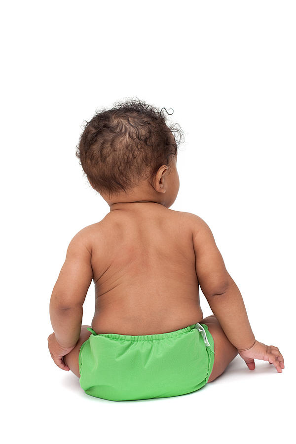 Baby in green cloth diaper from behind Photograph by Jfairone