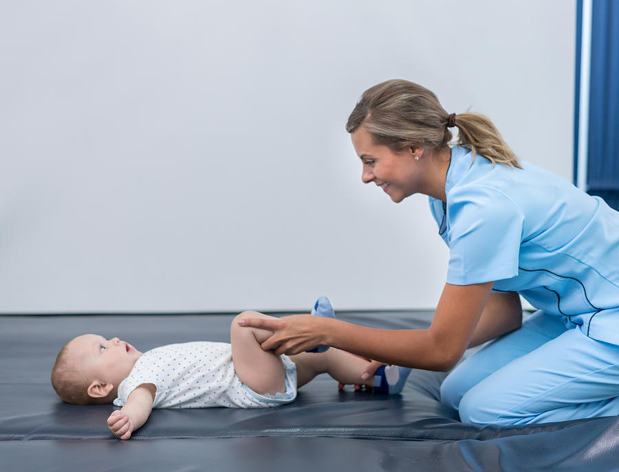 Baby in physical therapy Photograph by Andresr