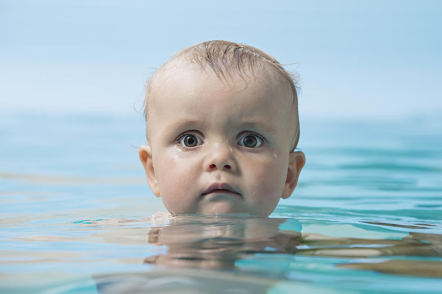 Baby in water Photograph by fStop Images - Vladimir Godnik