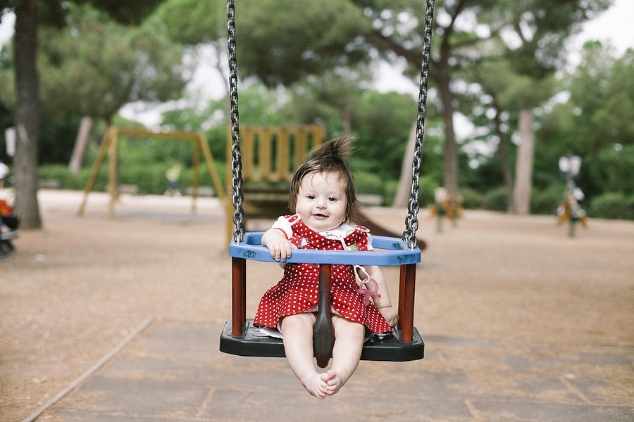 Baby on swing Photograph by Fabio Sabatini