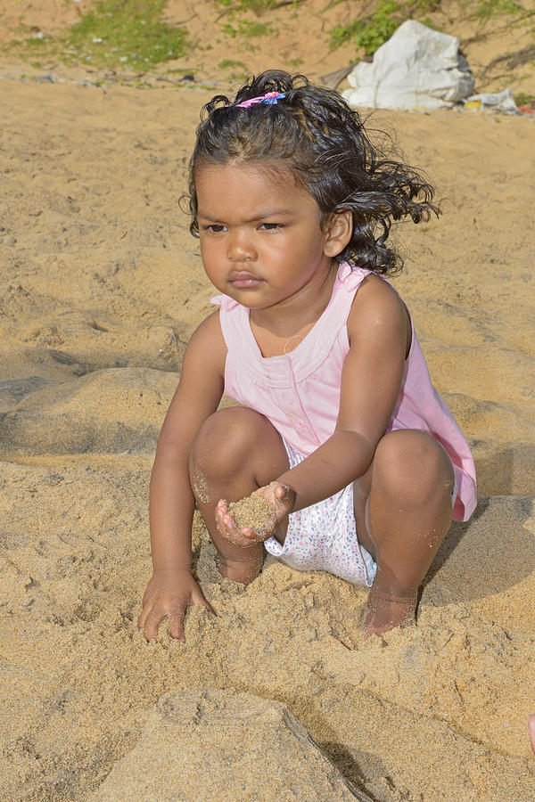 Baby playing with sand Photograph by Aditya Singh