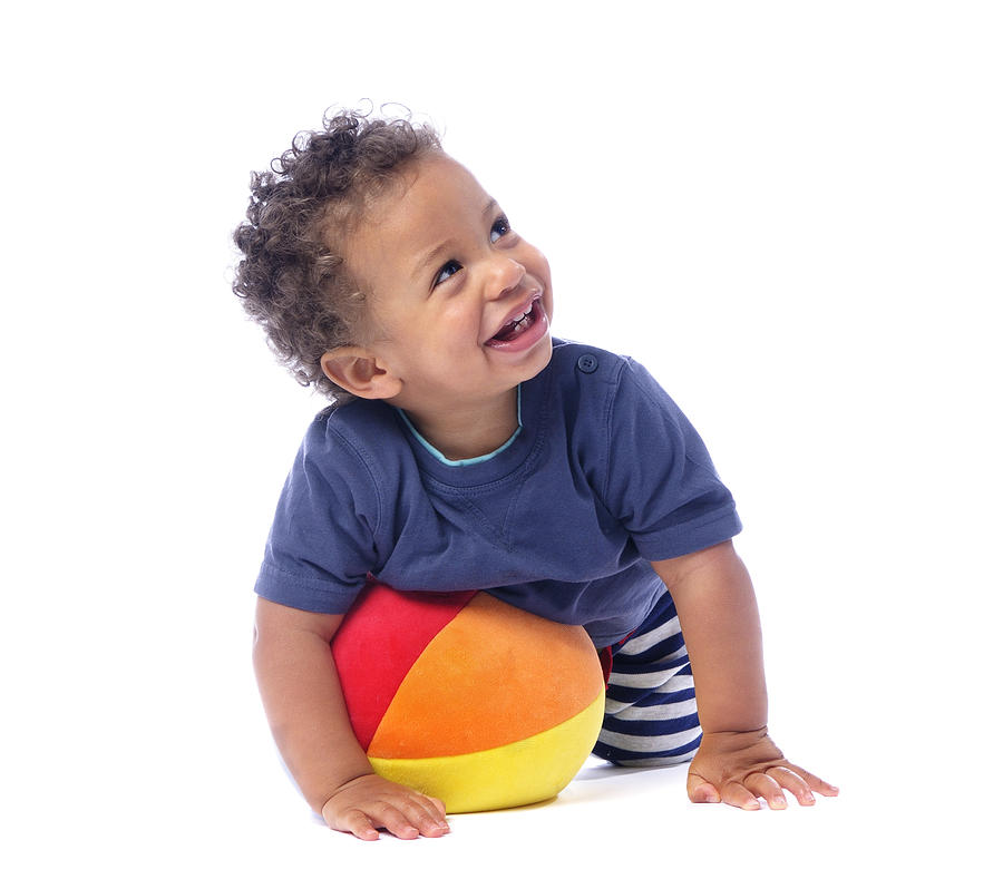 Baby Smiling And Looking Up While Playing With A Ball Photograph by Lostinbids