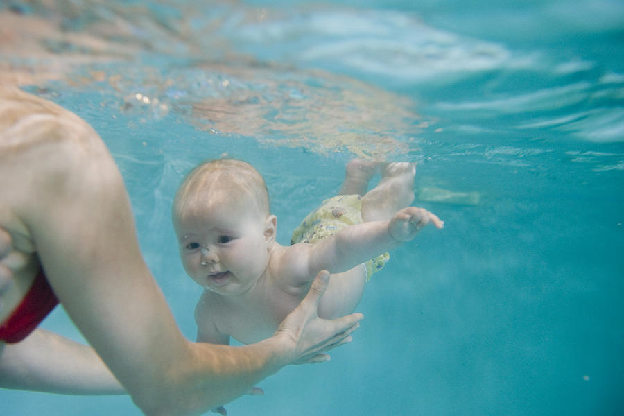 Baby swimming Photograph by Michaela Begsteiger