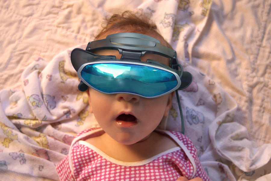 Baby wearing virtual reality goggles Photograph by Thinkstock Images