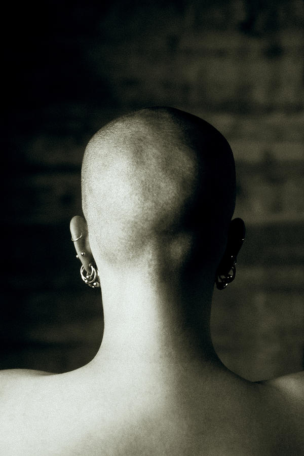 Back of womans shaved head Photograph by Thinkstock Images