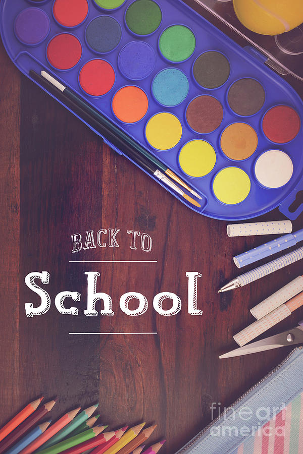 Back to School with coloring pencils paints. Photograph by Milleflore Images