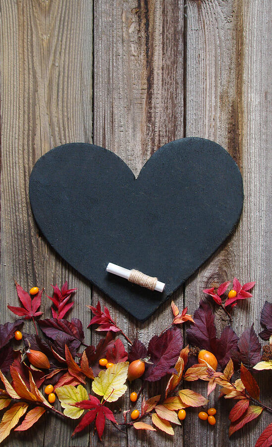 Background with autumn leaves, slate heart and chalk Photograph by Tashanat7519