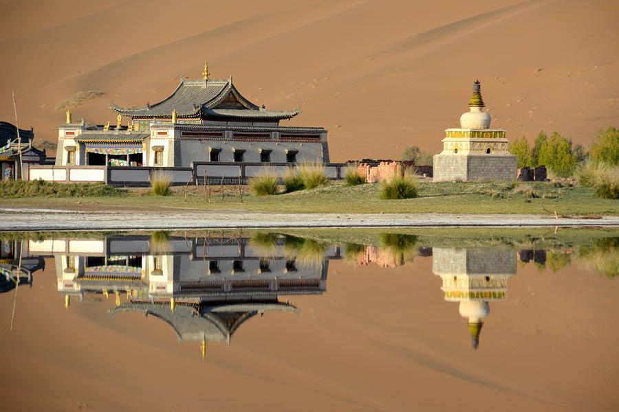 Badain Jaran Temple, reflecting on its lake, Inner Mongolia Photograph by Gionnixxx