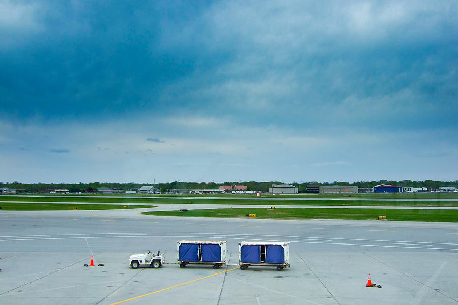Baggage cart on tarmac Photograph by Matthew Wilder Photography