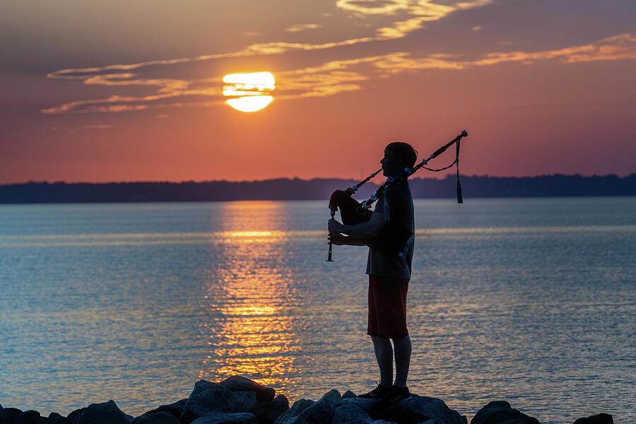 Bagpiper on the Rocks Photograph by Jerry Gammon