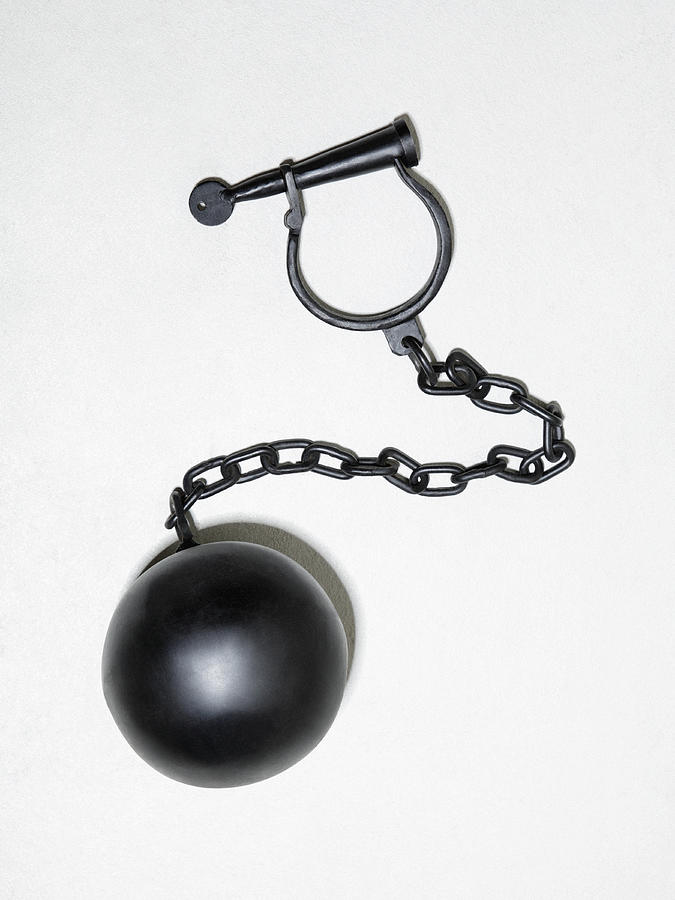 Ball and chain on concrete Photograph by Steven Puetzer