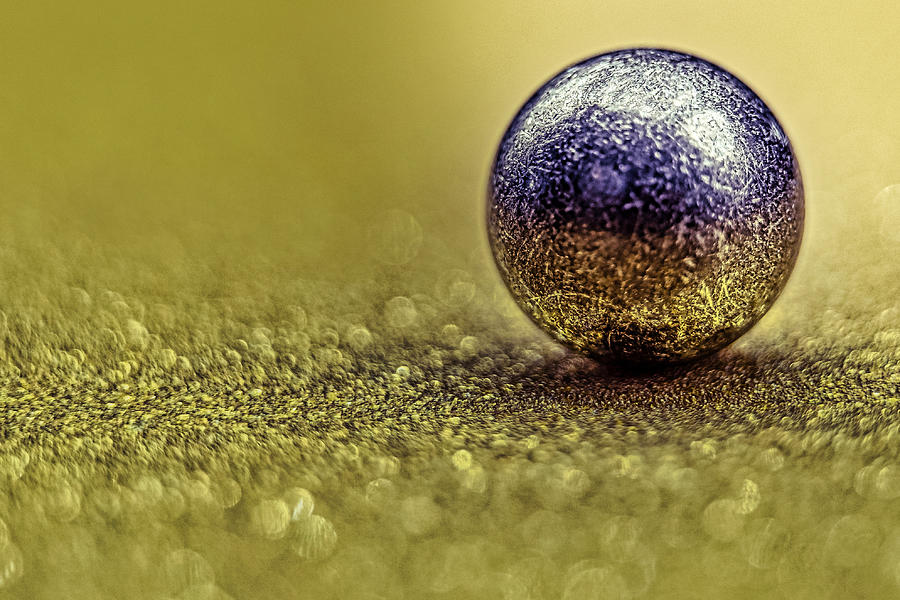 Ball Bearing on Glitter Paper Photograph by Stuart Litoff