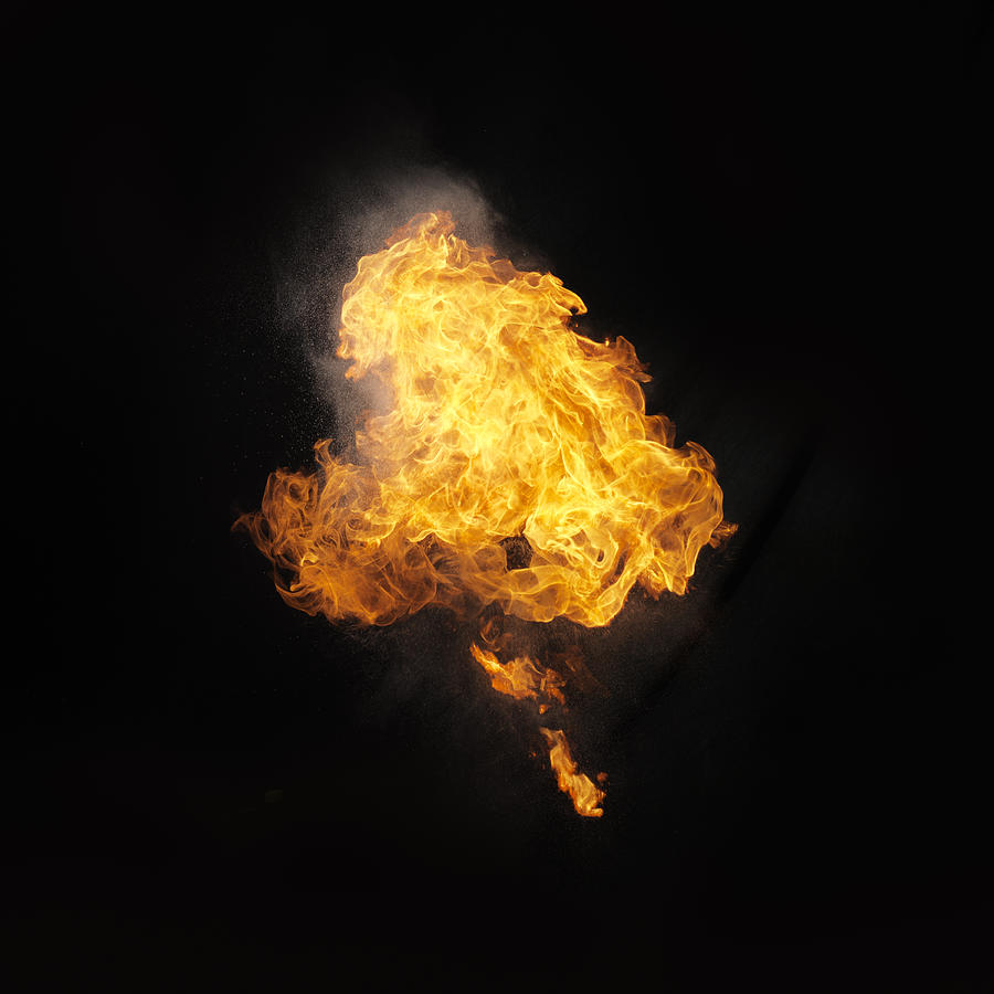 Ball of flames on black backdrop Photograph by Henrik Sorensen
