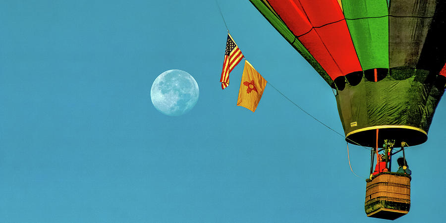 Balloon Fiesta with the Full Moon setting and the Sun Rising. Photograph by Tommy Farnsworth