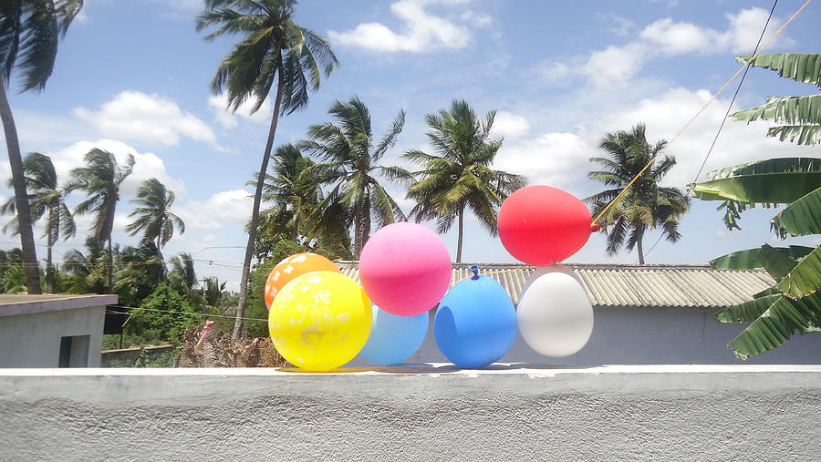 Balloons hanging on balcony Photograph by Suganya V / FOAP