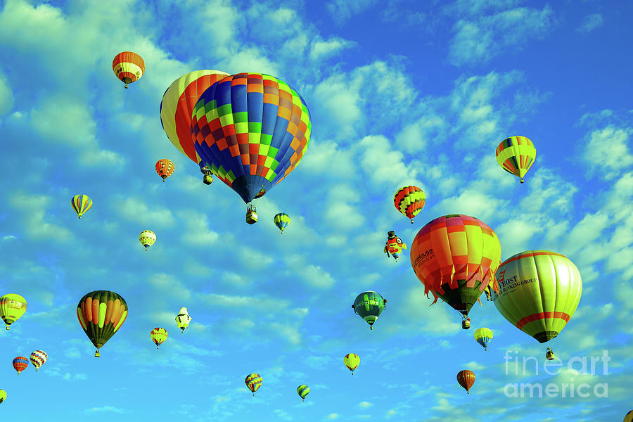 Balloons in the bright skies over the land of enchantment Photograph by Jeff Swan