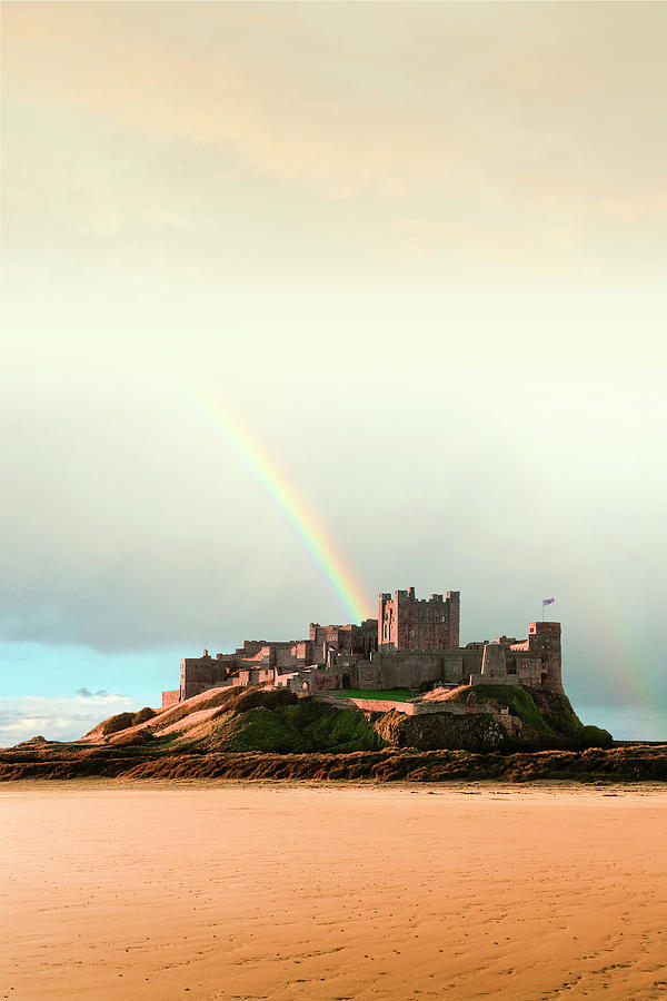 Bamburgh Castle Rainbow. Photograph by Steve Whitham - Pixels