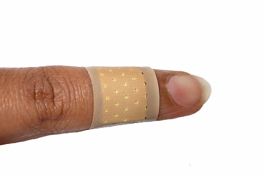 Band-aid on a finger Photograph by Visage