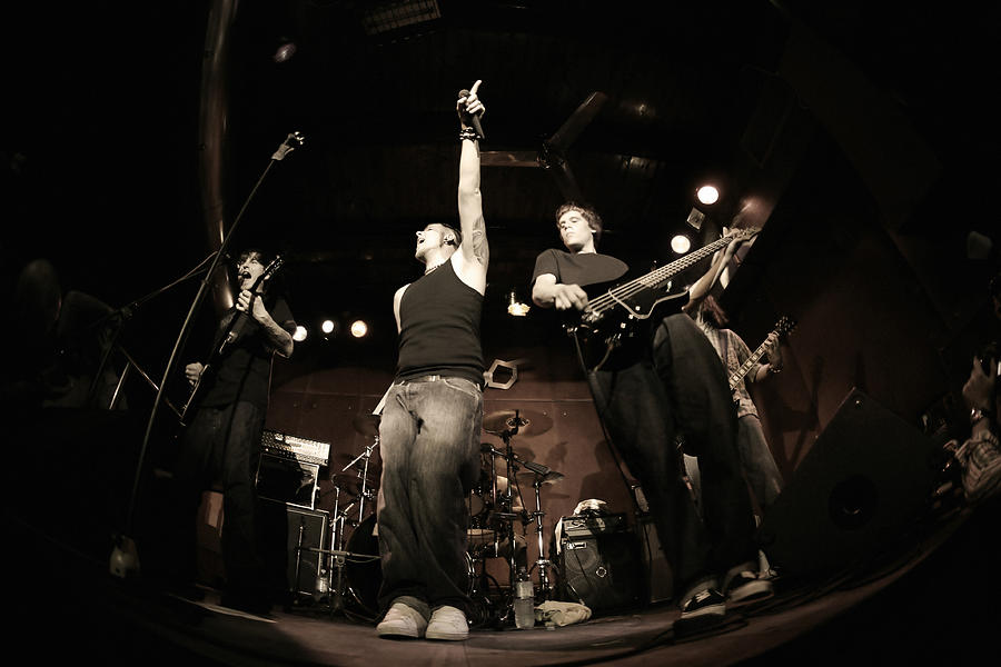 Band performing on stage, fisheye Photograph by Lisegagne