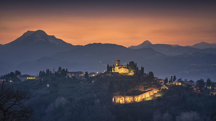 Barga town and Alpi Apuane mountains. Garfagnana, Tuscany Photograph by Stefano Orazzini