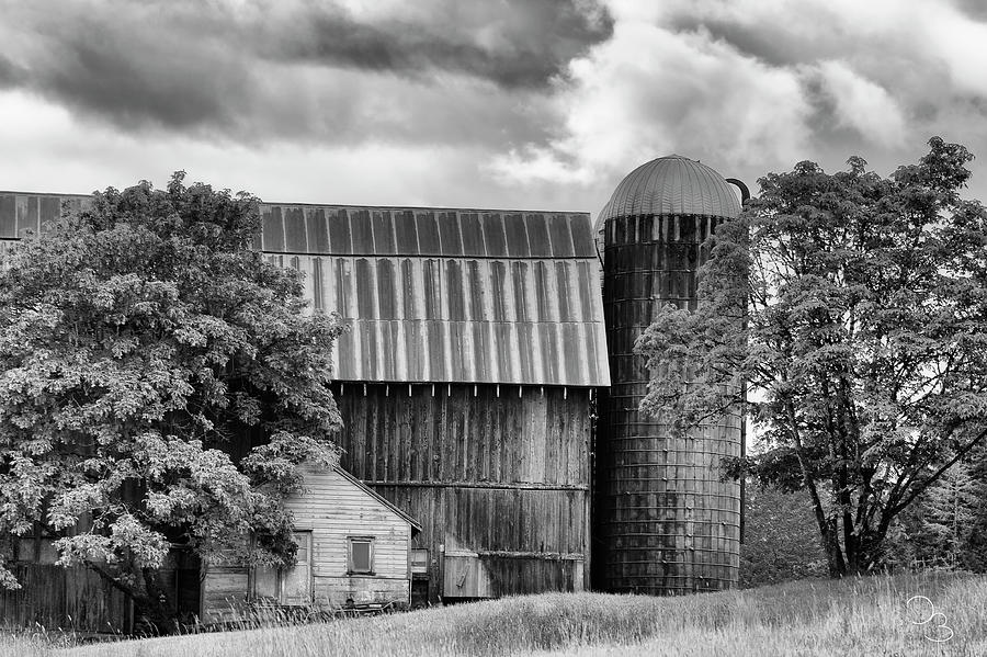 Barn and silo under cloudy sky Photograph by Dee Browning