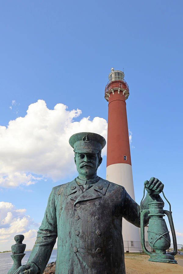 Barnegat Lighthouse and the Lighthouse Keeper Statue 2 Photograph by Allen Beatty