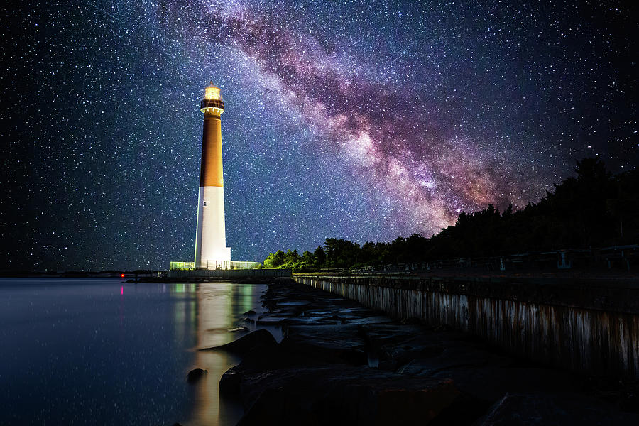 Barnegat Lighthouse under a starry night Photograph by Mihai Andritoiu