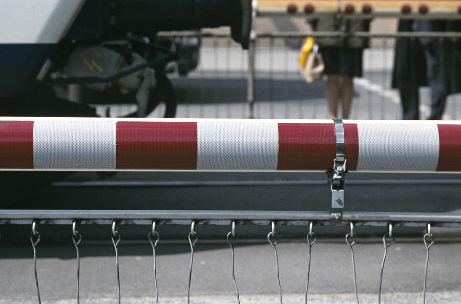 Barrier of rail road crossing Photograph by Achim Sass