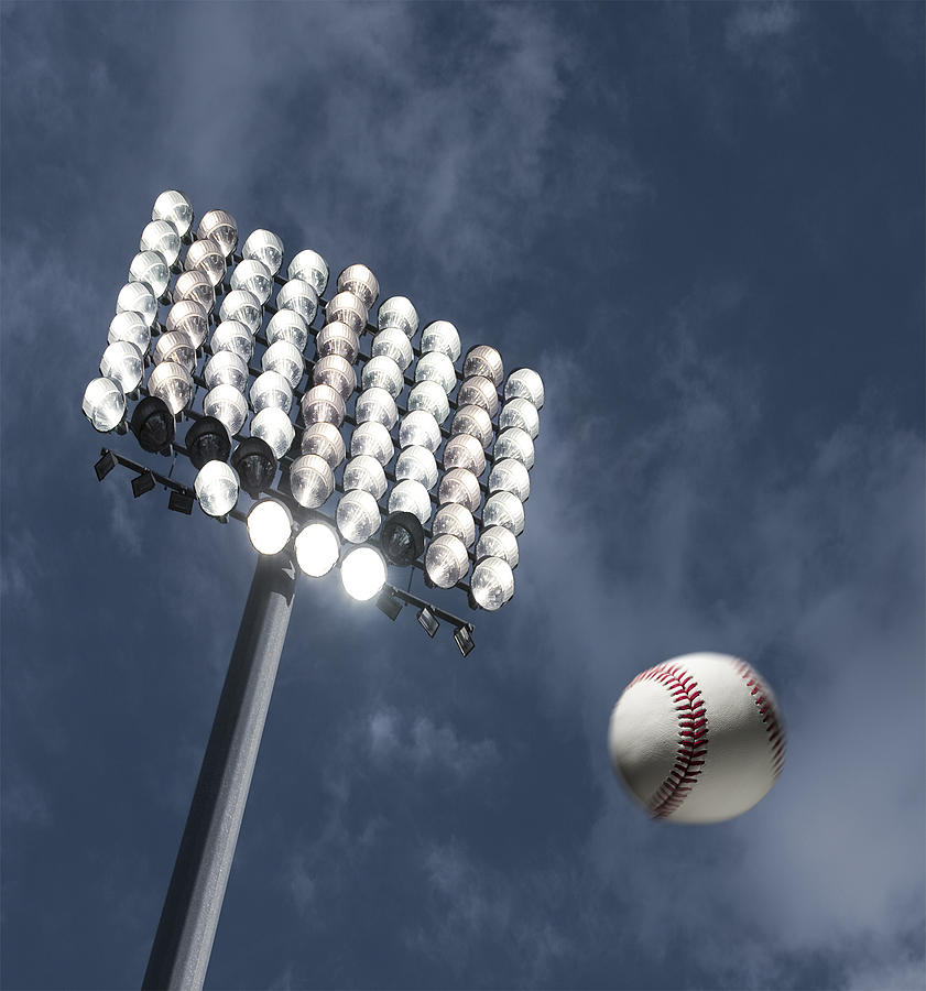 Baseball home run under the stadium lights Photograph by Pgiam