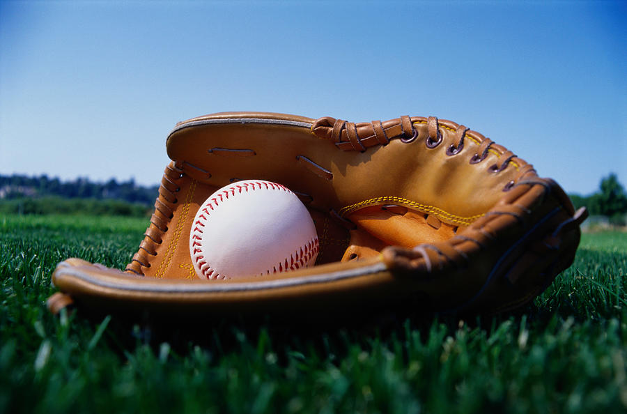 Baseball in a Glove Photograph by Ryan McVay