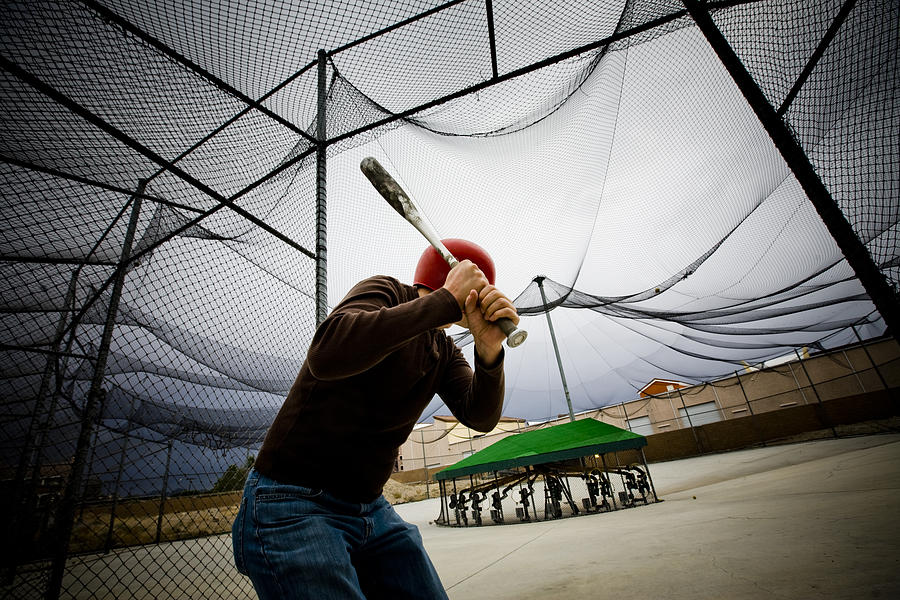 Baseball Practice: Man at Batting Cages Photograph by Renphoto