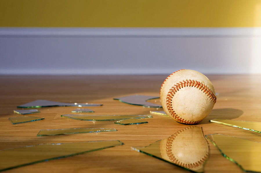 Baseball with Broken Window glass on wood floor Photograph by Cmannphoto